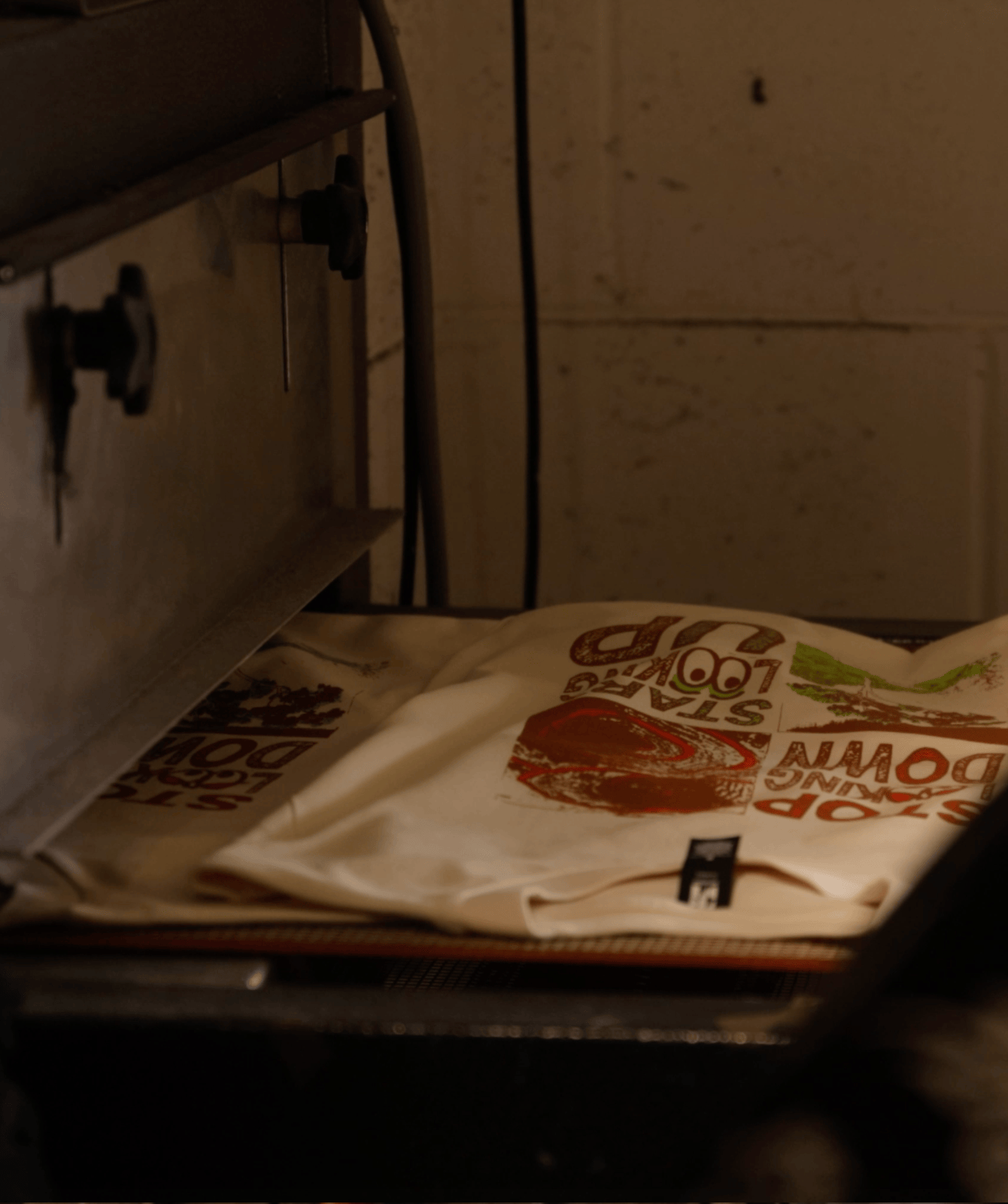 Cosmo Feltham T-shirt being screen-printed at Heavypress