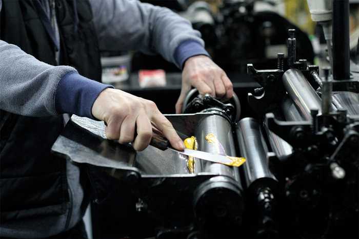 "Loading up the Heidelberg rollers with some Pantone 803"